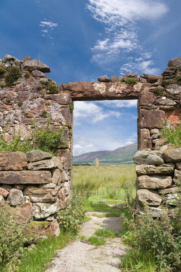 Ruined doorway looking towards neolithic standing stones, Machrie, Scotland. Ruined doorway looking towards neolithic standing stones, Machrie, Scotland