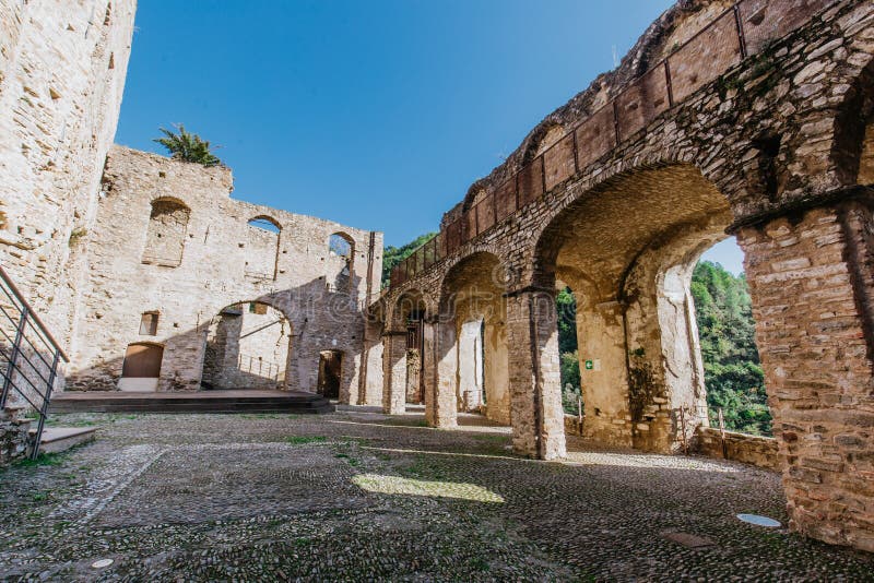 Ruins of the Doria Castle in Dolceacqua, arches and walls, daytime, Italy