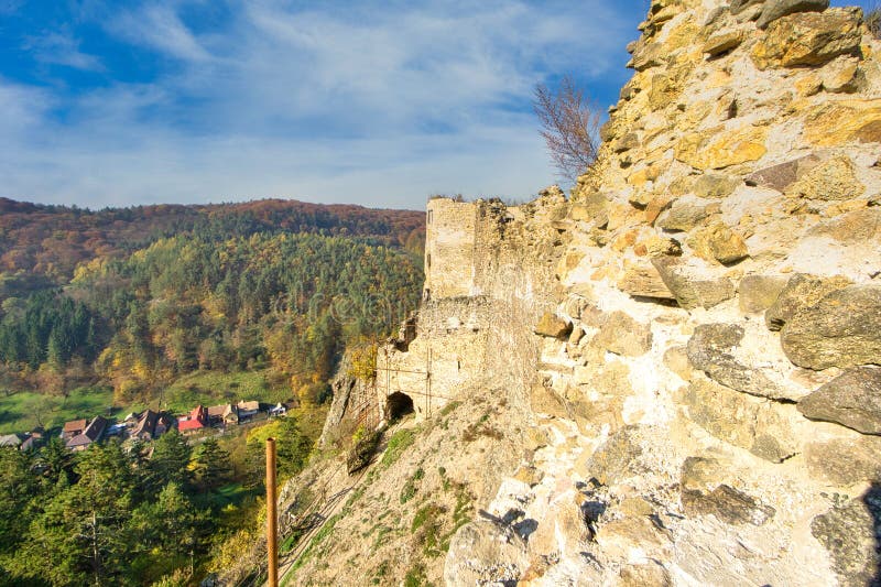 Ruins of hrad Sasov castle near river Hron during autumn