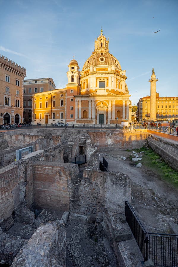 Sunset view on Auditorium di Adriano and Church of Santa Maria di Loreto in Rome. Concept of historical landmarks and travel Italy. Sunset view on Auditorium di Adriano and Church of Santa Maria di Loreto in Rome. Concept of historical landmarks and travel Italy