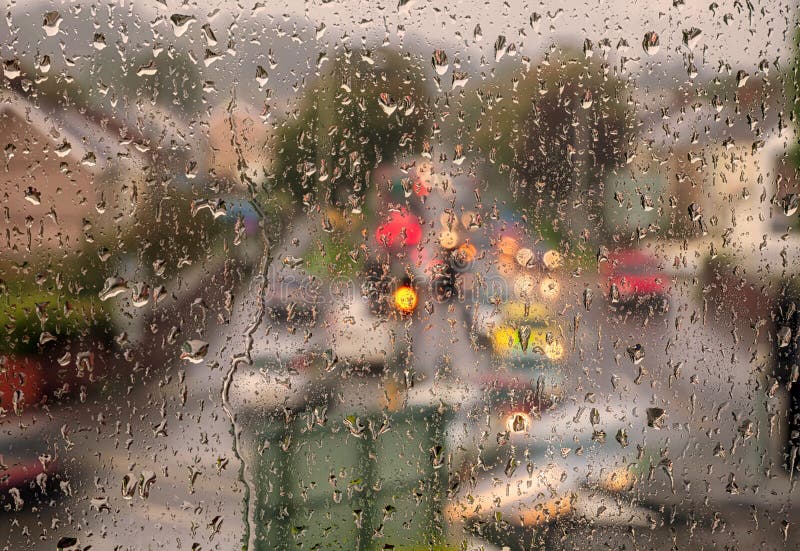 Swansea in the rain, one of the wettest cities in Britain, as seen through a window onto a traffic light junction. Swansea in the rain, one of the wettest cities in Britain, as seen through a window onto a traffic light junction.