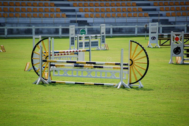View of an equestrian field, focus on jumping fence. View of an equestrian field, focus on jumping fence.