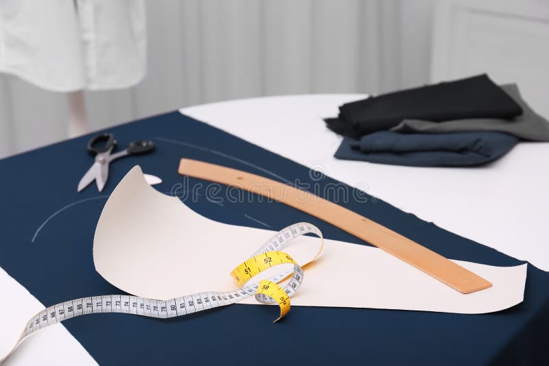 Ruler Measuring Tape Paper Template and Fabric on Table Stock Image Ruler Measuring Tape Paper Template and Fabric on Table Stock Image