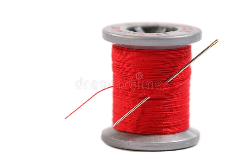 Spool of red thread on white background. Spool of red thread on white background