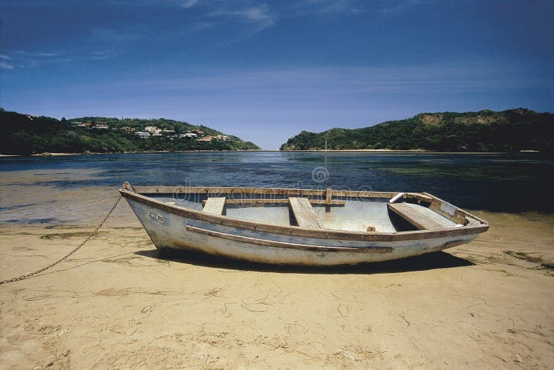 Rundown rowboat on beach