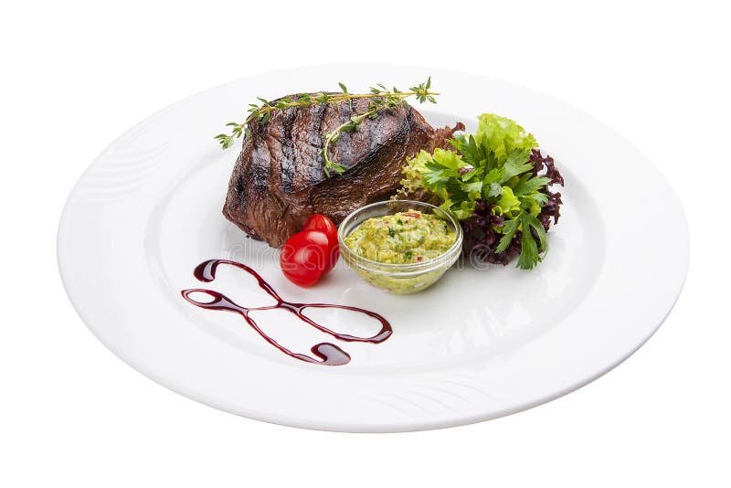 Rundvleeslapje vlees met Guacamole-saus Op een witte plaat stock afbeeldingen Rundvleeslapje vlees met Guacamole-saus Op een witte plaat stock afbeeldingen