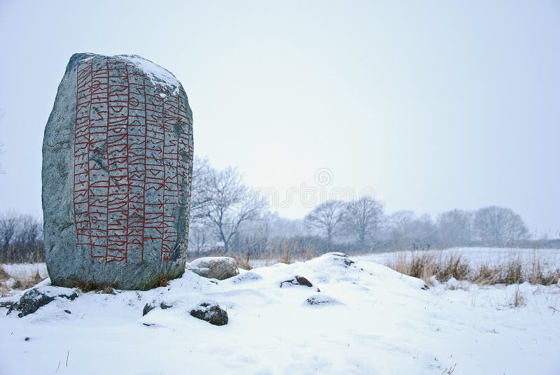 Rune-stone in winter landscape