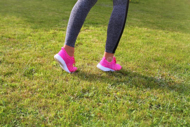 Runner athlete preparing to run the outdoor. Fitness woman training and jogging in summer park royalty free stock image Runner athlete preparing to run the outdoor. Fitness woman training and jogging in summer park royalty free stock image