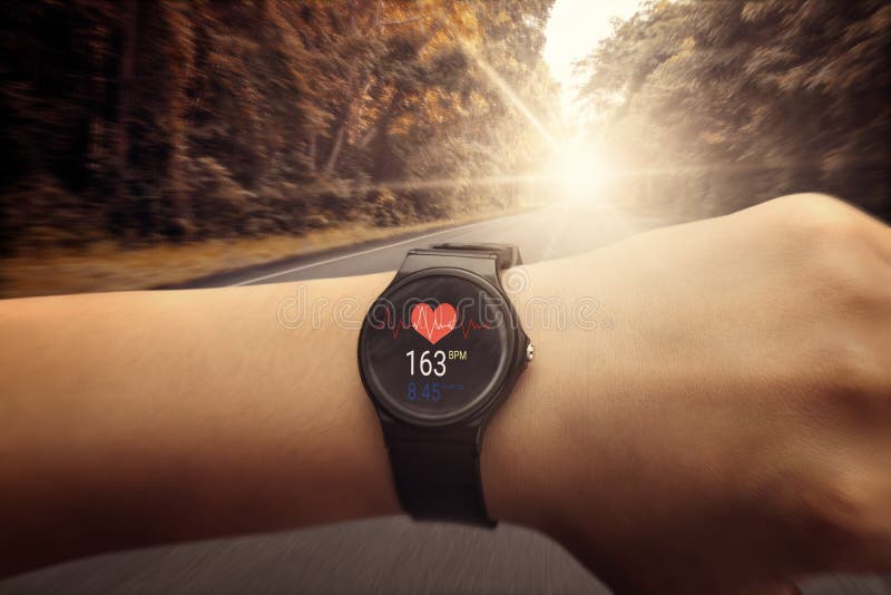 Runner Checking at Heart Rate Monitor Watch Running on Road in F Stock Photo - Image of