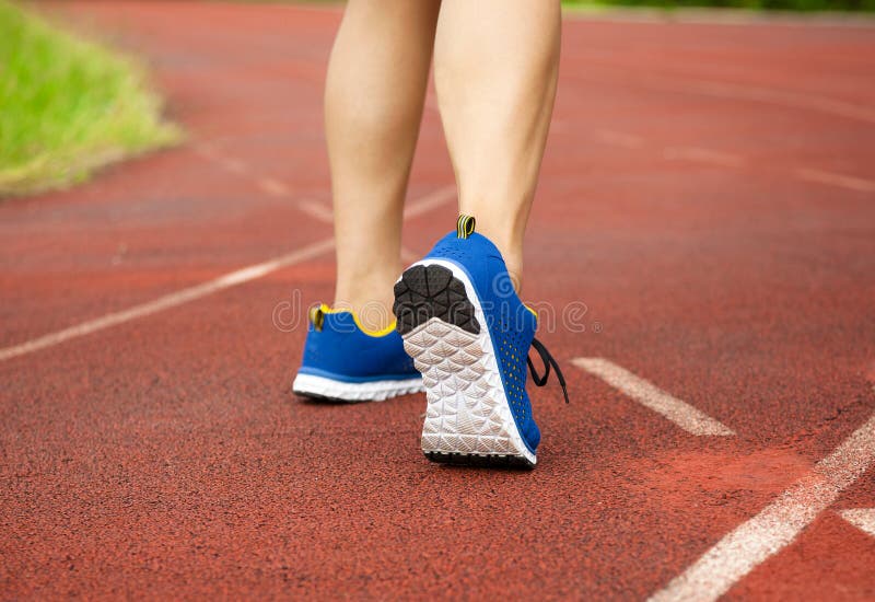 Runner feet running on track. workout wellness concept stock photos Runner feet running on track. workout wellness concept stock photos