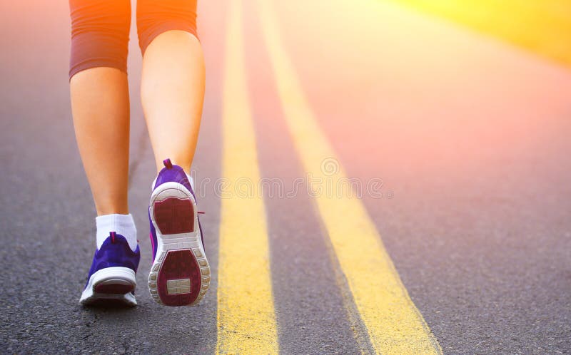 Runner Female Feet Running on Road. royalty free stock images Runner Female Feet Running on Road. royalty free stock images