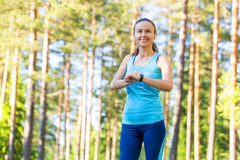 Runner Woman with Heart Rate Monitor for Running in Forest. Stock Photo - Image of monitor, girl