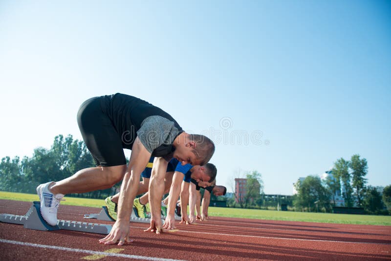 Runners Preparing for Race at Starting Blocks Stock Image Image of