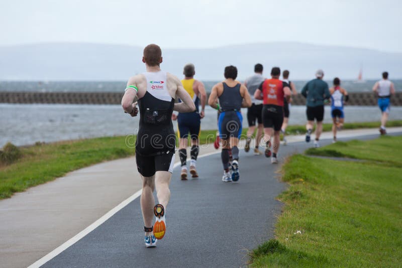 Runners, triathlon editorial image. Image of road, legs - 21079325