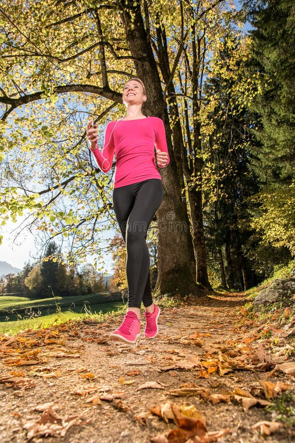 Running through the Autumn Forest Stock Photo - Image of motion, blond ...