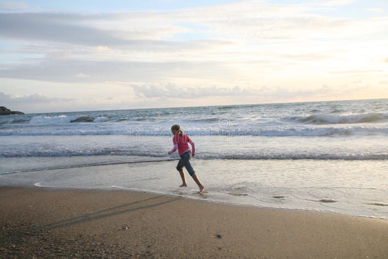 Running on the beach stock photos