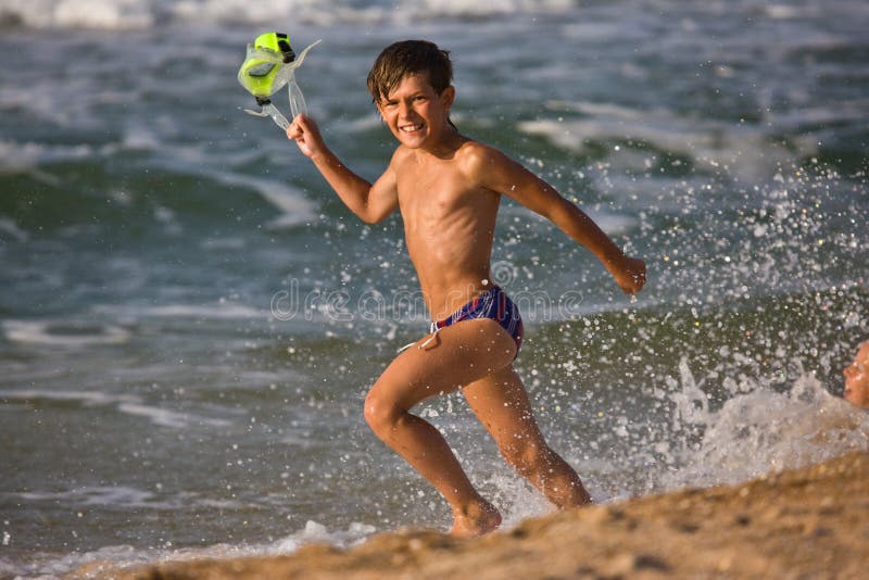 Playful boys enjoying the beach together, Stock Photo, Picture And Royalty  Free Image. Pic. BIM-BLD083548