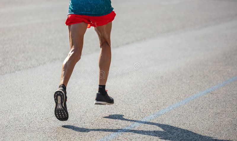 Running in the City Roads. Young Man Runner, Back View, Blur Background ...