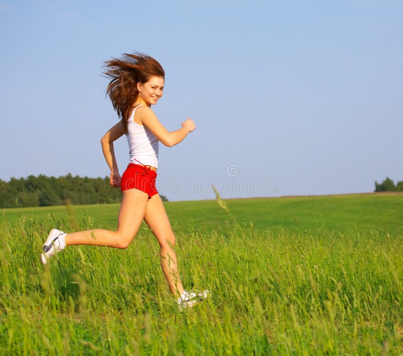 Running on the grass stock photo