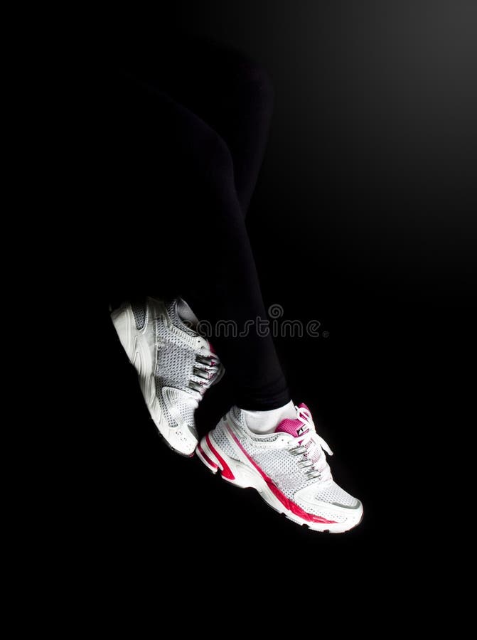 Woman legs in sport running shoes. Woman legs in sport running shoes