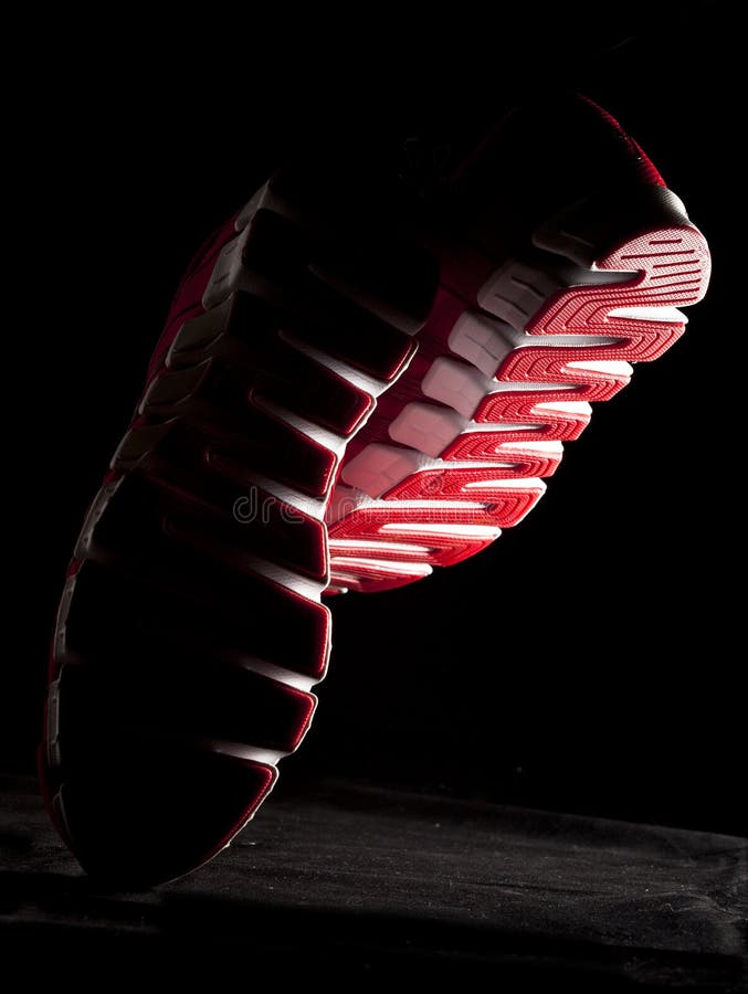 Running person bottom view, soles stock photography