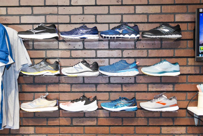 Running Shoes on Display on the Wall of a Running Shoe Store Editorial  Stock Photo - Image of activewear, commercial: 195211753