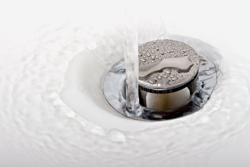 Running tap water in a sink down the drain