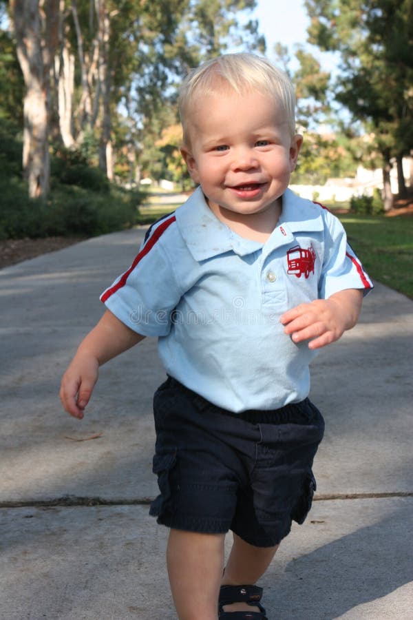 Running Toddler on path stock photos