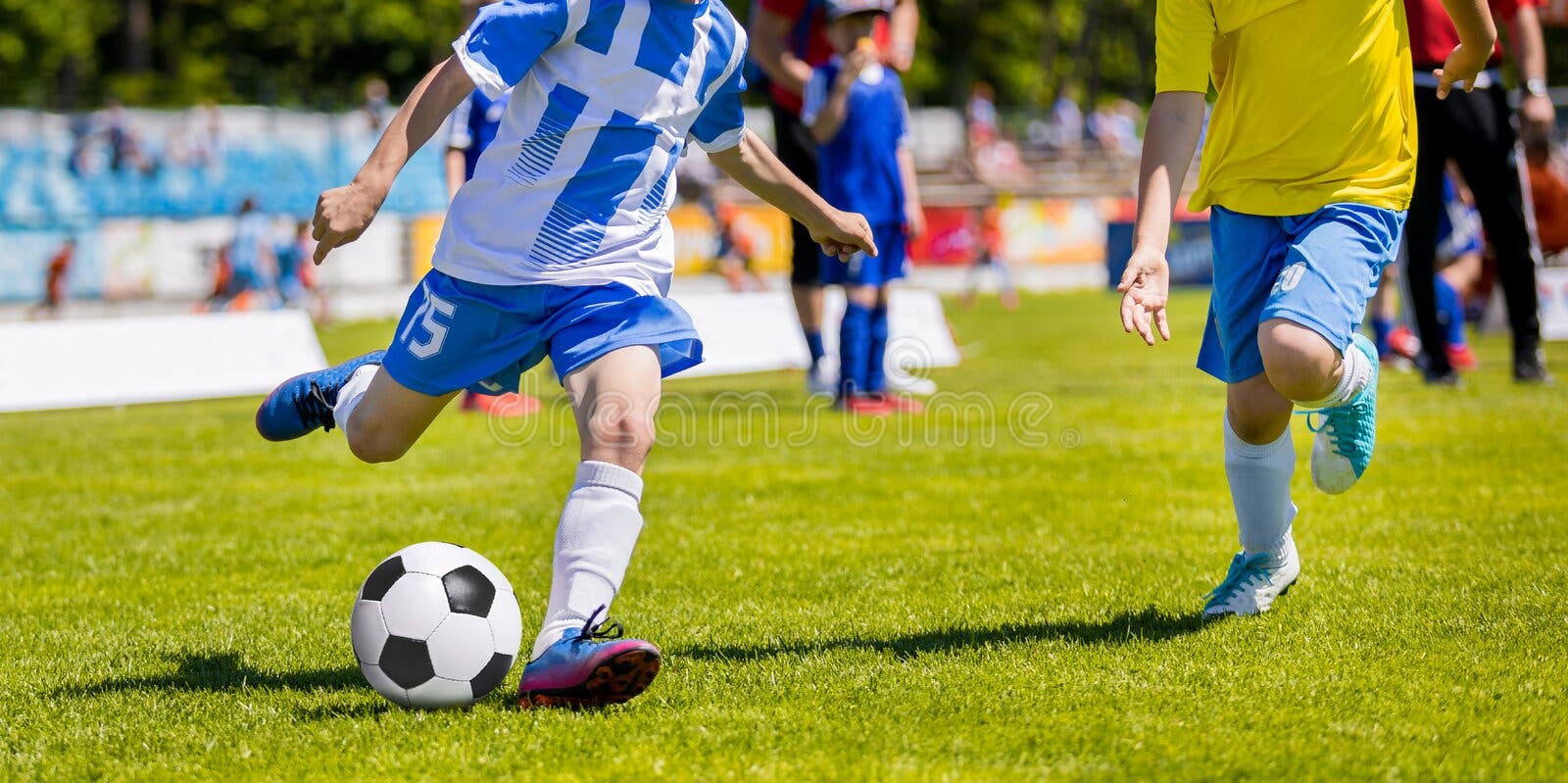 Boys kicking football stock image. Image of equipment 34918449