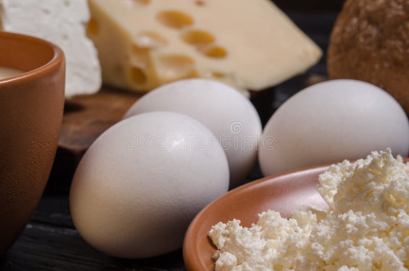 Rural breakfast. Bread, cheese, feta, cottage cheese, milk and e stock photo Rural breakfast. Bread, cheese, feta, cottage cheese, milk and e stock photo