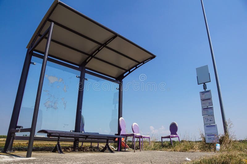 A Rural Bus Stop Next To Fields and Old Chair Damage Stock Image