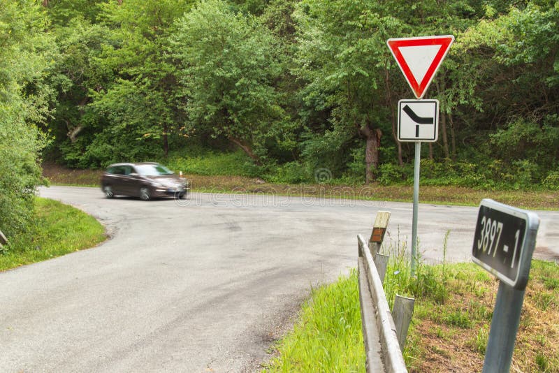 Rural crossroads in the Czech Republic. Traffic sign takes priority.