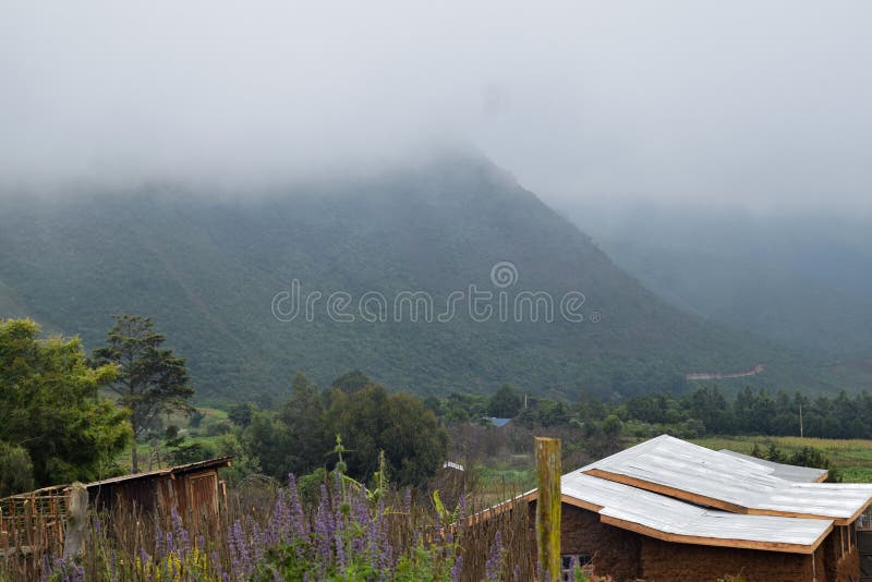 Rural homestead against mountain stock photo Rural homestead against mountain stock photo