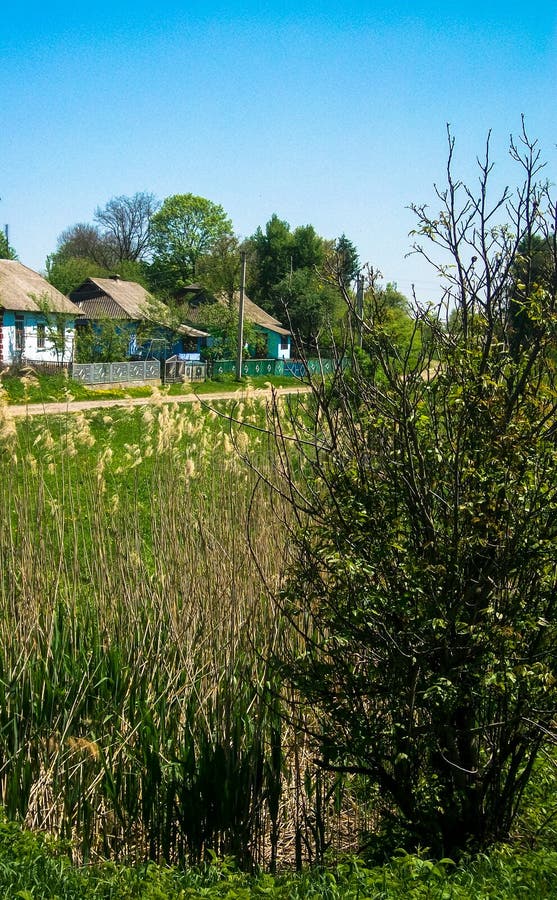 At The End Of The Hidden Greenery Rural Landscape Houses Hidden Greenery Stock Image - Image of grass