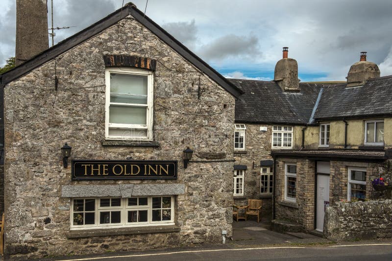 Widecombe in the Moor, Newton Abbot, Devon, England - August 01: Old Inn, rural pub with exposed stone walls and a list of real ales on August 01, 2015 in Widecombe in the Moor, Newton Abbot, Devon, England. Widecombe in the Moor, Newton Abbot, Devon, England - August 01: Old Inn, rural pub with exposed stone walls and a list of real ales on August 01, 2015 in Widecombe in the Moor, Newton Abbot, Devon, England