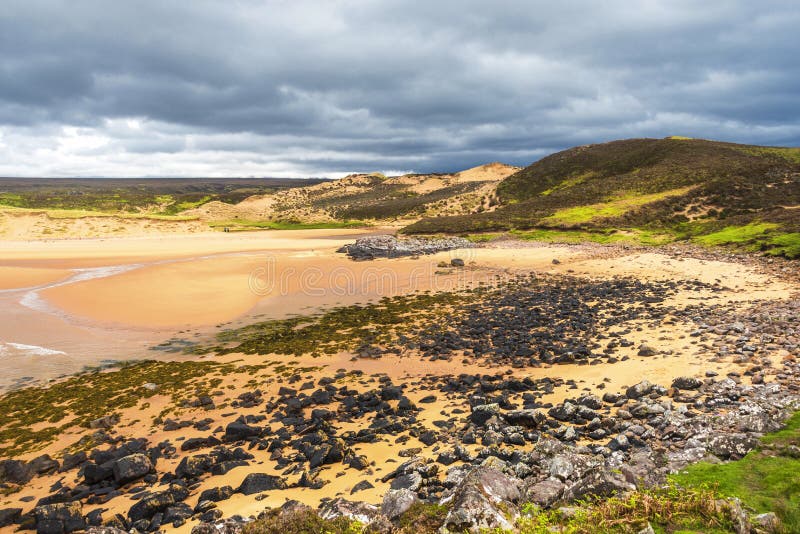 Landscape on the road to Red Point beach, Wester Ross. Rural views in wester ross with the red point beach and a cloudy sky in the background stock photo Landscape on the road to Red Point beach, Wester Ross. Rural views in wester ross with the red point beach and a cloudy sky in the background stock photo