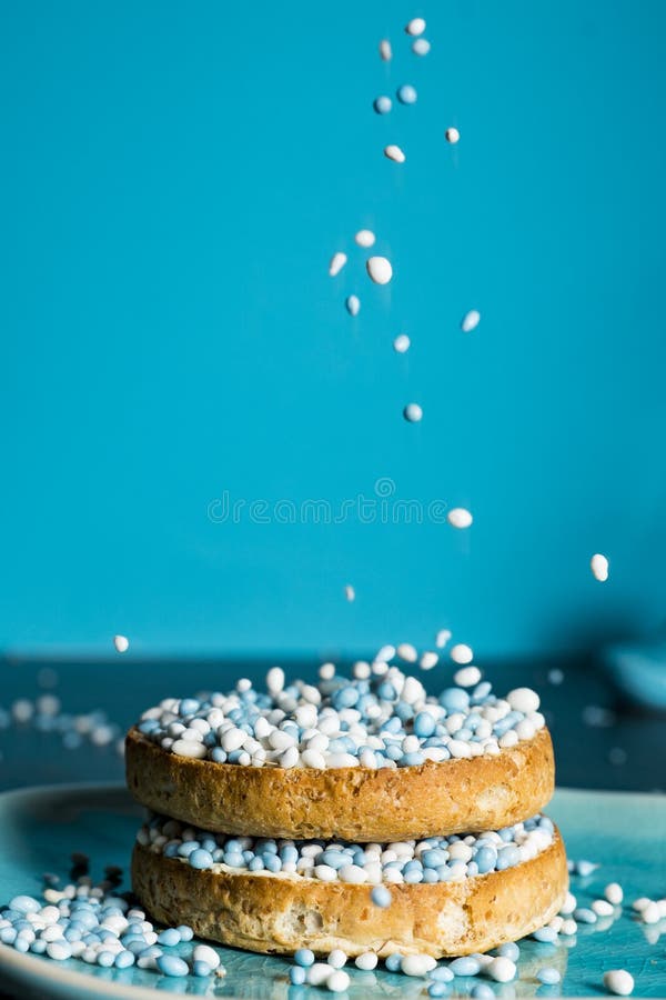 Rusk with blue aniseed balls, muisjes, tradition in the Netherlands to celebrate the birth of a son stock photos Rusk with blue aniseed balls, muisjes, tradition in the Netherlands to celebrate the birth of a son stock photos
