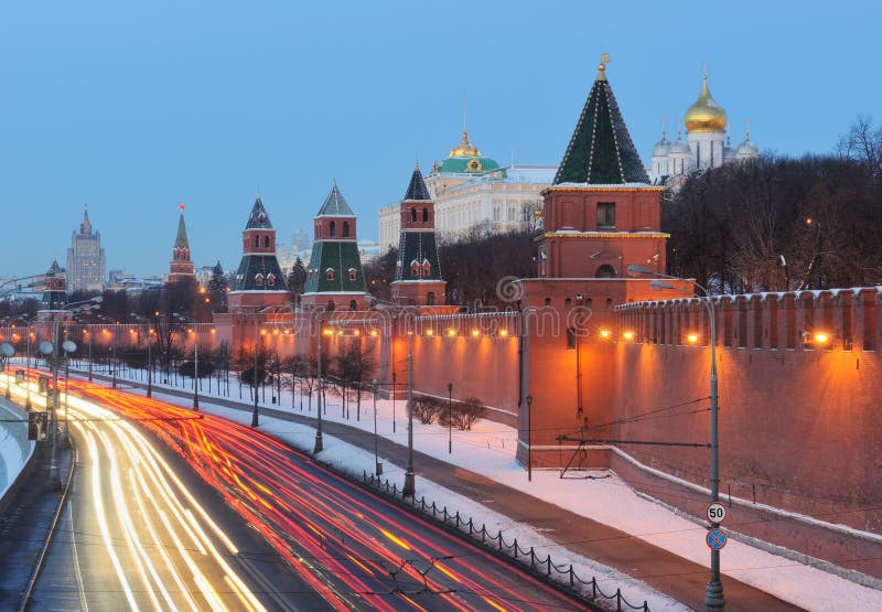 Russia. Ensemble of Moscow Kremlin. View on Kremlin wall and towers from Bolshoi Moskvoretsky bridge at a sunrise. Russia. Ensemble of Moscow Kremlin. View on Kremlin wall and towers from Bolshoi Moskvoretsky bridge at a sunrise