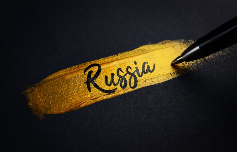 Russia Handwriting Text on Golden Paint Brush Stroke Stock Image