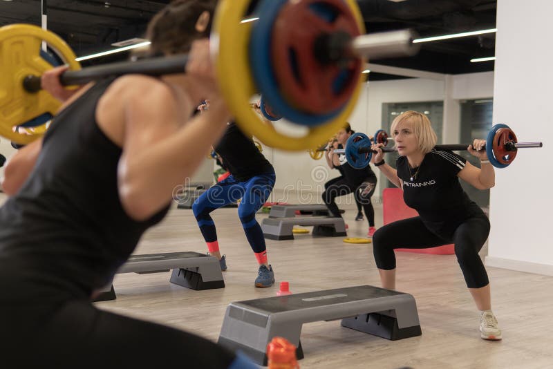 RUSSIA, MOSCOW - FEB 14, 2022: barbell group young woman strong, for exercise workout for beautiful from weight person stock images RUSSIA, MOSCOW - FEB 14, 2022: barbell group young woman strong, for exercise workout for beautiful from weight person stock images