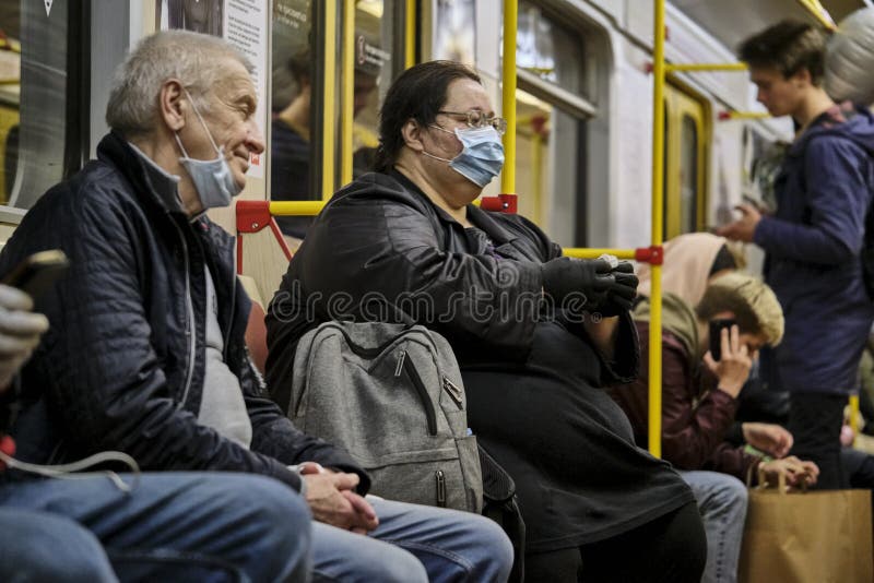 Russia Moscow June 2020. Moscow metro. people in protective masks ride in a subway car. coronavirus epidemic in Russia. viral risk royalty free stock image Russia Moscow June 2020. Moscow metro. people in protective masks ride in a subway car. coronavirus epidemic in Russia. viral risk royalty free stock image
