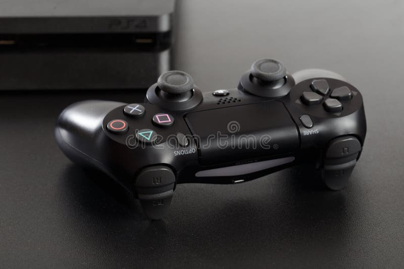 Russia, OCTOBER 24 2019: The new Sony Dualshock 4 with PlayStation 4. Sony PlayStation 4 game console of the eighth generation. - stock photography