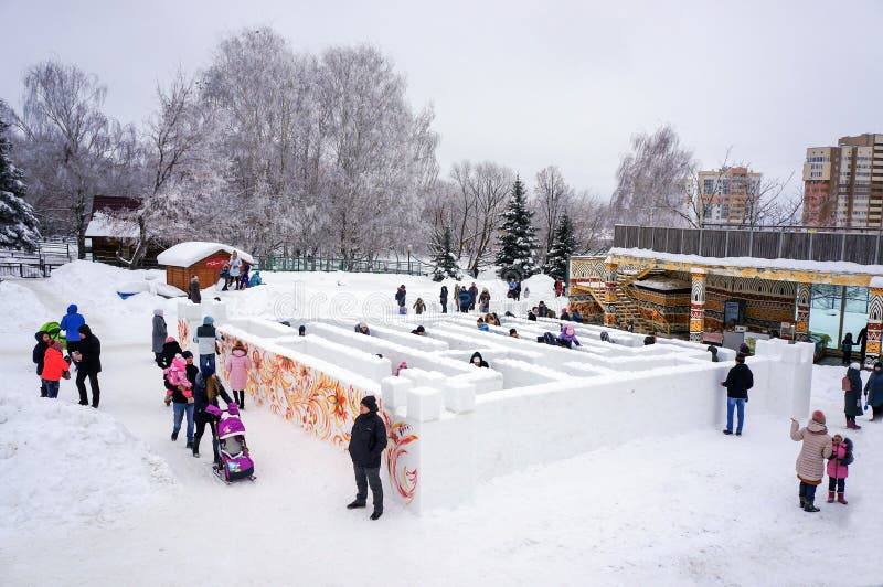 Russia. Penza. Citizens play in a maze made of snow. Russia. Penza. Winter holiday. Citizens play in a maze made of snow. Frosty snowy winter day. Lots of joy royalty free stock photo Russia. Penza. Citizens play in a maze made of snow. Russia. Penza. Winter holiday. Citizens play in a maze made of snow. Frosty snowy winter day. Lots of joy royalty free stock photo