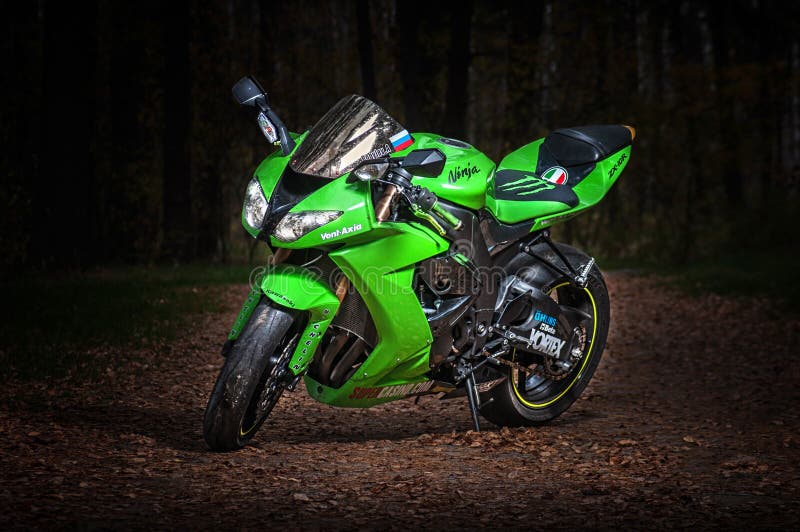 RUSSIA Ryazan, 20.10.2016 - Sport motorcycle kawasaki zx-10r at the dark road stock photos RUSSIA Ryazan, 20.10.2016 - Sport motorcycle kawasaki zx-10r at the dark road stock photos