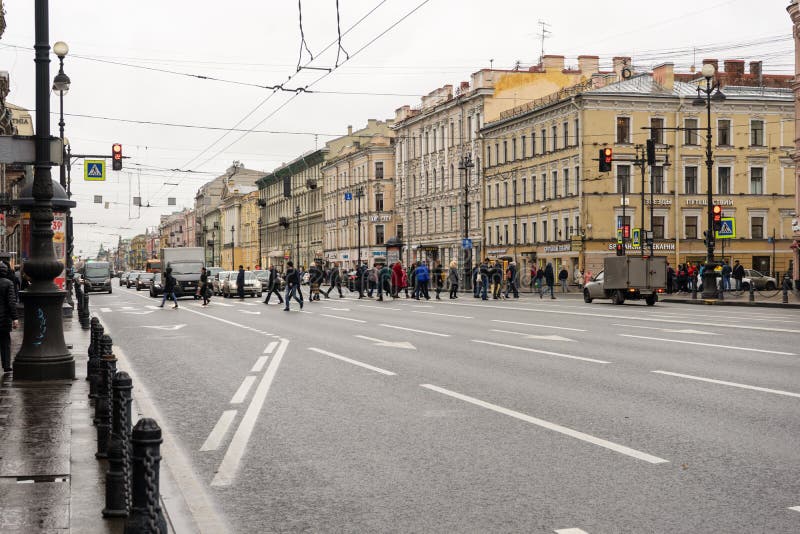 10/21/2019 Russia. Saint Petersburg. Nevsky Avenue. People cross the road on a cloudy autumn day royalty free stock photo 10/21/2019 Russia. Saint Petersburg. Nevsky Avenue. People cross the road on a cloudy autumn day royalty free stock photo