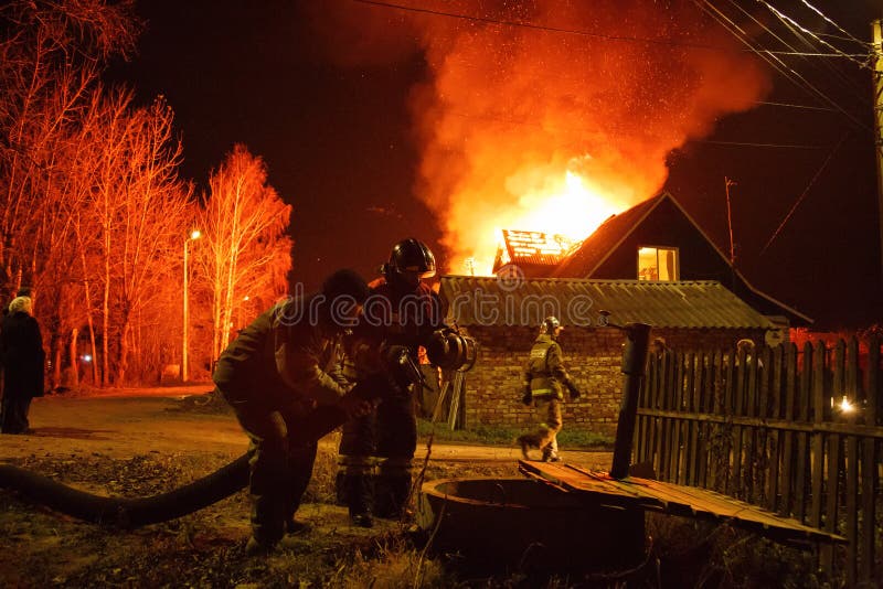 Russia, Saint - Petersburg, Peterhof 20/10/2016. Firemen extinguishing country house