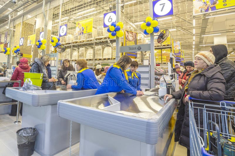 Buyers pay for purchases at the cash desk in the Auchan store.