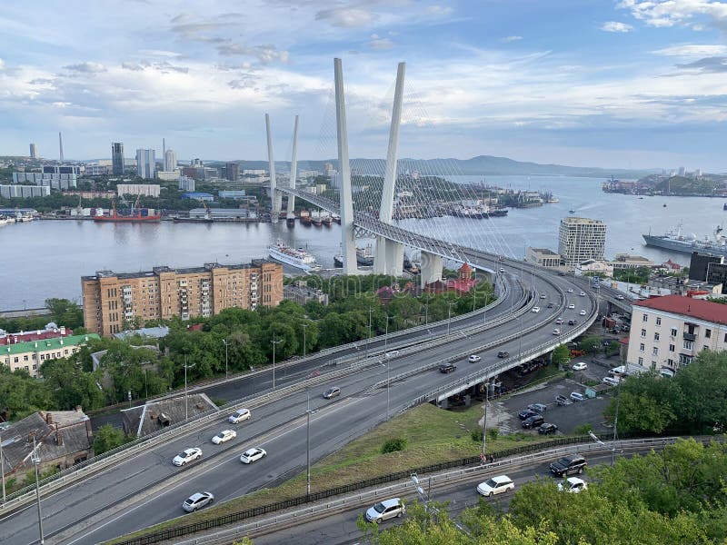 Russia, Vladivostok. Evening summer view of the city from the `Eagle`s nest` hill in cloudy weather. stock photos Russia, Vladivostok. Evening summer view of the city from the `Eagle`s nest` hill in cloudy weather. stock photos