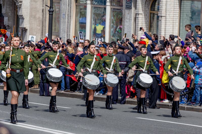 Russia, Vladivostok, 05/09/2018. Nice ladies drummers in stylish military uniform on annual parade on Victory Day on May`9. Holiday commemorates victory of USSR over Nazi Germany in World War 2