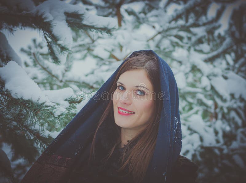 Russian Beautiful Girl Near The Christmas Tree In The Woods Lit By